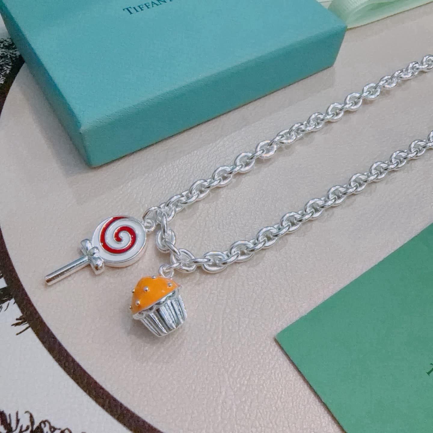 Tiffany & Co. Silver Charm Necklace with Lollipop and Cupcake Charms
